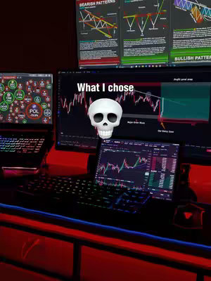 A setup displaying multiple computer screens with financial charts, a glowing keyboard, and a skull. The image is dark with red and blue light accents. A text overlay says 'What I chose.'