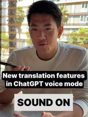 A man is centered in the frame. He appears to be indoors because there are window blinds behind him. He is holding a phone in one hand. The image is warmly lit. The words 'New translation features in ChatGPT voice mode SOUND ON' are clearly visible with text on the image.
