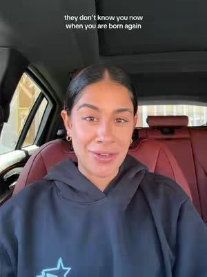The cover image is a selfie taken from inside a car. The focus is on a woman with dark hair and hoop earrings, framed from the chest up. She is wearing a black hoodie and the background shows the car's interior with burgundy seats. Text is overlaid on the top, written in a sans-serif font.