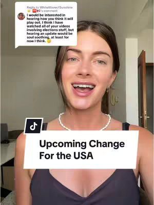 A woman with dark hair and a slight smile is framed from the chest up against a backdrop of a blurred interior. The frame has a white rectangular box saying "Upcoming Change For the USA". The top of the frame is the woman's face, smiling, speaking, in a room lit by natural light.