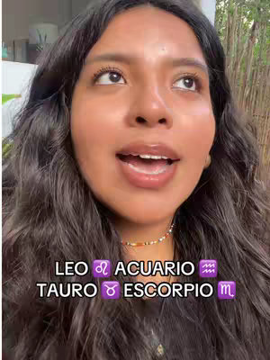 A woman with dark hair and a neutral facial expression looks upwards with her mouth slightly open. Below her, text overlays state zodiac signs.