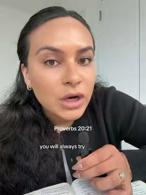 A woman with long, dark hair and fair skin is close to the camera, speaking with a microphone in hand. Text overlays at the bottom describe the verse and translation from Proverbs.