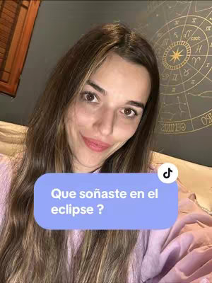 A selfie-style shot featuring a woman in a bedroom setting. She is smiling and looking directly at the camera. Behind her is a backdrop with a dark, textured surface and a decorative circular object. A speech bubble with text is superimposed on the image, and a TikTok logo is visible, indicating the content's platform origin.