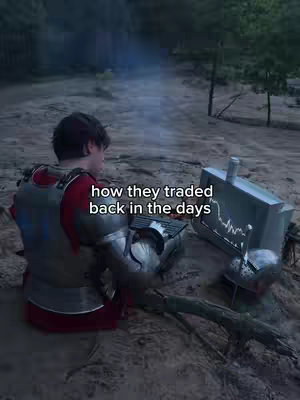 A person in medieval armor is seated near a metal contraption depicting a stock chart, suggesting a humorous juxtaposition of historical and financial themes. Smoke from a small fire adds ambiance to the outdoor setting, and text overlays the image, adding to the narrative.