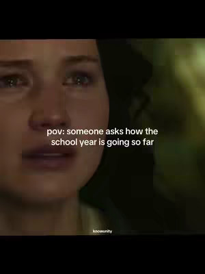 The image shows a close-up of a person's face, likely a woman, with tears in their eyes. The background is blurred, and a text overlay states, "pov: someone asks how the school year is going so far".