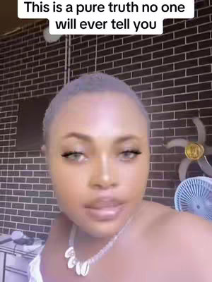 The cover image features a close-up shot of a woman with light skin and light eyes. She is positioned in the center, looking slightly upwards. Above, prominent white text says, 'This is a pure truth no one will ever tell you.' The background is a dark brick wall with some elements of a room present, like a ceiling fan