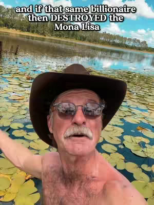 A man with a hat and sunglasses is in a body of water, surrounded by lilypads. The background shows a lake and trees with a blue sky. Text is overlayed at the top.