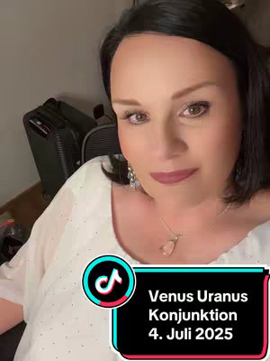 A woman with dark hair and a white top is framed in a selfie-style shot. She has a soft expression and is gazing slightly off-camera. A text overlay with a teal and black background displays astrological information, with the TikTok logo visible to the left.