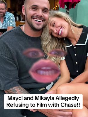 A selfie-style photo featuring a man and a woman smiling and embracing. Overlayed on the image are distorted graphic elements meant to represent a face, along with a text overlay. The background appears blurred, suggesting an outdoor setting.