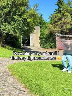 A wide shot of a lush green park with a paved path on the left. In the mid-ground, a person in blue jeans and white shoes stands on the grass. Text overlays the image, and in the background, there is a stone archway.