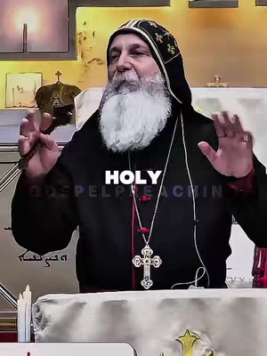 The image showcases a bishop in religious attire with a long white beard. He is positioned from the chest up with arms raised showing open palms. The background is a gradient, and the word "Holy" is overlaid in white text with "GOSPEL PREACHING".
