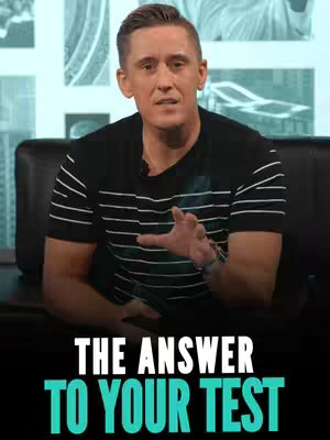 The image presents a man in a black and white striped t-shirt, seated on a black couch with a blurred cityscape background. Text reading 'THE ANSWER TO YOUR TEST' is placed at the bottom of the image in white and teal colors.
