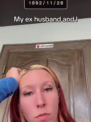 A young woman with blonde and red-streaked hair gazes at the camera with a slightly downcast expression, resting her hand on her head. The background is a nondescript interior, featuring a closed door and a sign that reads
"Employees Only." Above her head, a rectangular text box displays the date "1992/11/28."