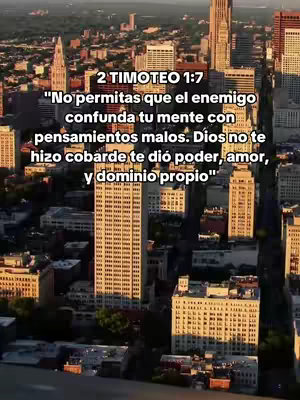 An aerial view of a city skyline, dominated by tall skyscrapers and buildings. The image is composed of shades of brown and beige, providing a warm color palette. Text overlays appear in the upper portion of the image with a bible verse.