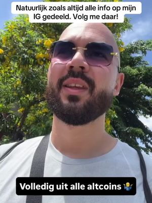 A man with a shaved head, sunglasses, and a beard is shown from the chest up, with text overlays at the top and bottom of the image, set against a background of green foliage and a blue sky.