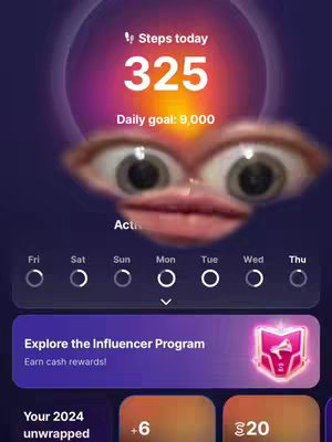 The cover image is a screenshot of a fitness app interface, overlaid with a humorous face. The app display features a purple and gradient background. At the top, it displays 'Steps today' and '325' in large white font, with 'Daily goal: 9,000' underneath also in white. Below this, the overlaid face, comprised of exaggerated eyes and lips, is positioned. The bottom of the screen shows a weekly activity tracker and buttons related to the app's options. A purple bar reads 'Explore the Influencer Program'. The color scheme includes purples, oranges, and whites, promoting accessibility and a clean design.