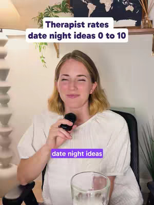 A woman holding a microphone, sitting in a chair with a neutral expression. The background consists of neutral-colored walls with a world map and plants, and text overlays with information about date night ideas.