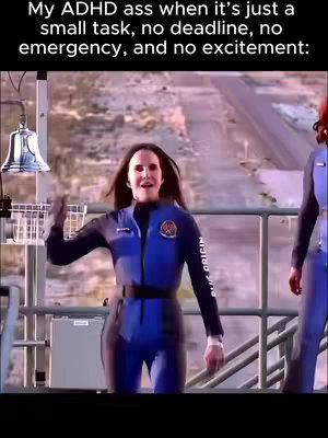 The image features a woman in a blue jumpsuit with the words "Blue Origin" written on it. The background shows a landscape that might be somewhere outside, possibly near a launch site. The woman gestures and seems to be in motion.
