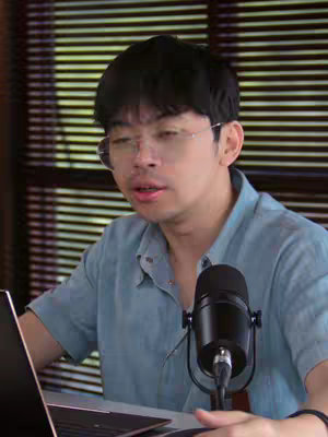 The cover image features a man seated near a laptop, speaking into a microphone. He's wearing glasses, and a light blue shirt. Blinds are in the background.