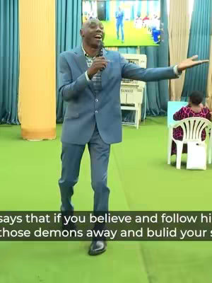 A man in a blue suit is speaking into a microphone in a church setting. Text is overlaid at the bottom.