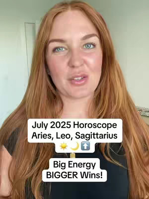 A medium shot shows a woman with long red hair and blue eyes looking directly at the camera. Overlay text in white appears on the screen, detailing the horoscopes for July 2025 for Aries, Leo, and Sagittarius, along with text that says: “Big Energy BIGGER Wins!”.