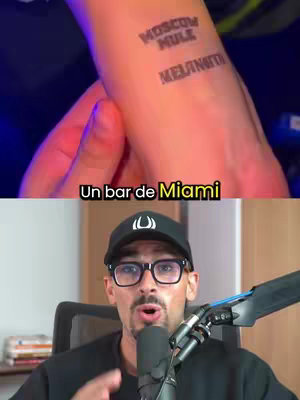 The cover image is divided into two sections. The top portion focuses on a tattooed arm, displaying the words 'MOSCOW MULE' and 'MELANIN' in a bold, black font. The bottom section features a man wearing glasses and a black hat with a microphone aimed at him, suggesting he is a speaker or interviewer..