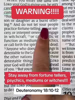 A close-up image focuses on a hand pointing to a passage in the Bible. The text is in the background, with two red rectangular text overlays: one at the top reading 'WARNING!!!!' and another at the bottom that says, 'Stay away from fortune tellers, psychics, mediums or witches!!!' Below this, the scripture reference Deuteronomy 18:10-12 appears.
