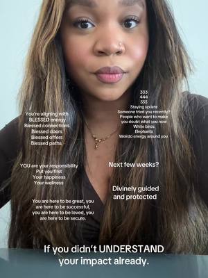 A close-up shot features a woman with long, wavy brown hair looking directly at the camera. She has light skin, a small nose ring, and full lips with subtle makeup. Text overlays in white fonts are scattered across the image, containing inspirational messages and what appear to be angel numbers.