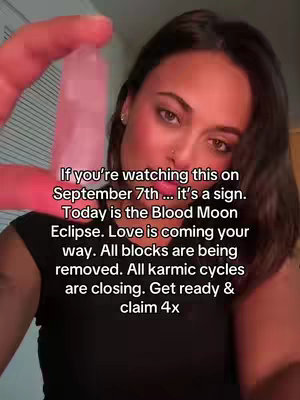 A woman holds up a clear crystal and looks at the camera. Text overlays appear, set against a background of a room.