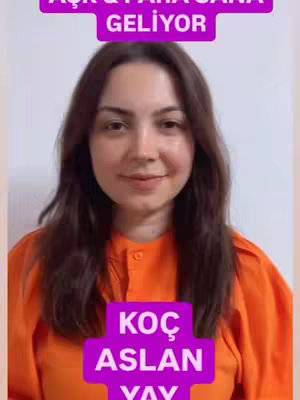 A woman with long dark hair and fair skin is centered in the frame, wearing an orange top. Above her, a purple banner reads in Turkish, 'Aşk & Para Sana Geliyor' (Love & Money is Coming to You). Below her, another purple banner displays in Turkish 'Koç, Aslan, Yay', indicating astrology zodiac signs. The background appears to be a plain white wall.