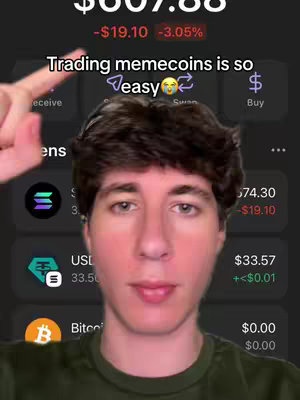 A selfie video with the creator in the center, a male with short brown hair, facing the camera directly, with a mobile trading app visible in the background.