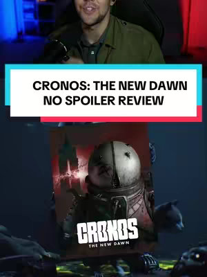 The image is a vertical video cover, featuring a man speaking into a microphone in the top half. In the bottom half, there is a game poster of Cronos: The New Dawn. The man in the top portion is centered, wearing a green jacket with a microphone in front of him. The Cronos poster is in the center with a blue, red and black background. The poster has a futuristic character and title.