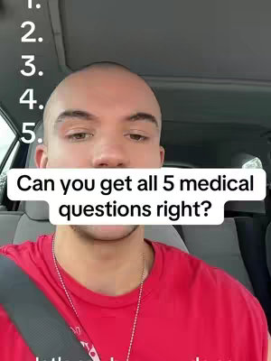 A man in a red shirt inside a car looks at the camera, with a white text box overlay.