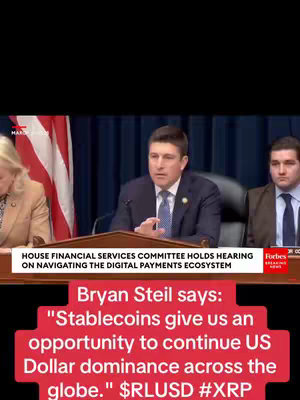 The image shows a seated panel discussion taking place in a hearing room. A man in a dark suit and tie is speaking. Above, text indicates the event is a House Financial Services Committee hearing on digital payments. Below, a text overlay in red reads the speaker's quote about stablecoins and US Dollar dominance, with relevant hashtags.