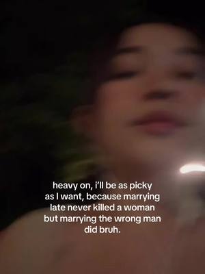 A slightly blurred, close-up shot of a person's face, appearing to be a selfie. The person is in the foreground, illuminated with soft lighting. Overlayed on the image is white text, with a dark background.