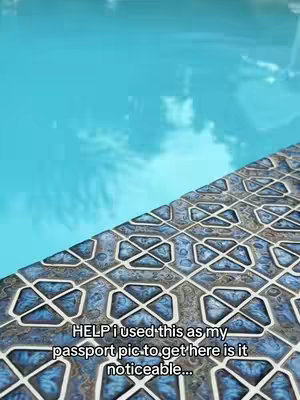 The cover image shows a corner of a swimming pool. The water is a bright turquoise color, and the surface reflects the sky. Diagonal to the pool is a tiled area with a blue and white geometric pattern. Overlayed on the image is the white text. The composition is simple, but the bright colors create a cheerful, inviting feel.