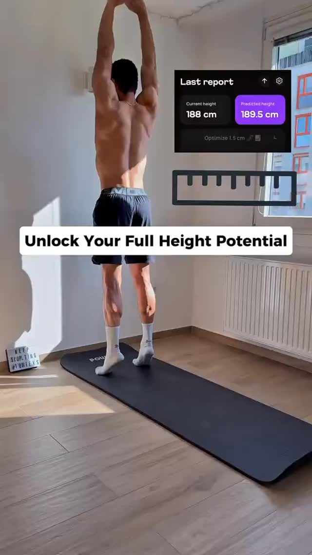 A man stands on a black exercise mat, arms raised overhead as if stretching. The background shows a minimalist room with unadorned walls and a window to the side. On the right, a digital display shows height metrics, and a ruler icon is placed below it. Text overlayed at the bottom reads, "Unlock Your Full Height Potential," presented in a clear, modern font within a white box. The man is shirtless wearing black shorts and white socks.