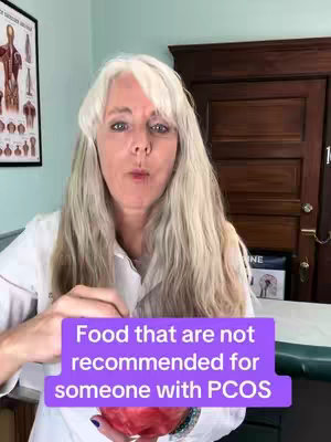 A woman with long, light-colored hair is centered in the frame, holding a red fruit near her mouth, as if about to eat it. She is wearing a white lab coat. Behind her is a wall with a medical chart and a dark wooden door. A purple banner with white text, "Food that are not recommended for someone with PCOS", is overlaid at the bottom.