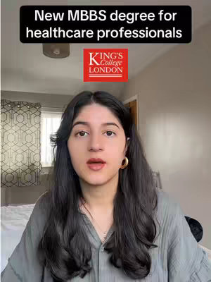 A woman with dark hair is centered, looking slightly to the side, with a neutral expression. Overlayed text reads 'New MBBS degree for healthcare professionals' in a black bar at the top. Below the text is the King's College London logo, set against a red square. The background is a bedroom setting with a window/curtain.