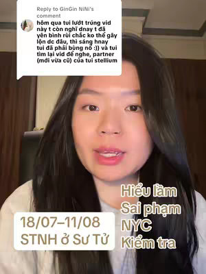 A woman with long dark hair is centered in the frame, looking directly at the camera. A comment bubble with white background has been attached on the top left corner of the frame , with text on the left side, and four text boxes at the bottom right containing the Vietnamese phrases: 'Hiểu lầm', 'Sai phạm', 'NYC', 'Kiểm tra'.