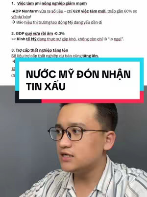 The cover image features a man wearing glasses, looking towards the camera. The background contains white text over a dark background. A text overlay in a colored box reads 'NƯỚC MỸ ĐÓN NHẬN TIN XẤU'.