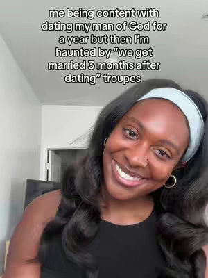 A woman with long black hair smiles into the camera. The image is well-lit with warm tones. Text overlayed on the image conveys a message.