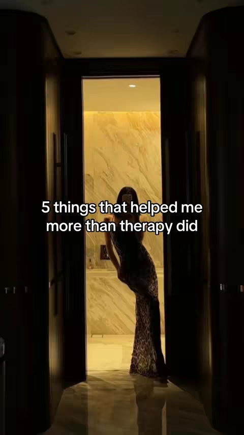 The cover image shows a person standing in a doorway with text overlayed. The person is silhouetted, wearing a patterned dress, and holding a phone up to take a picture in front of a mirror. The doorway leads to what appears to be a bathroom with marble walls. The lighting is dim, creating an overall aesthetic effect.