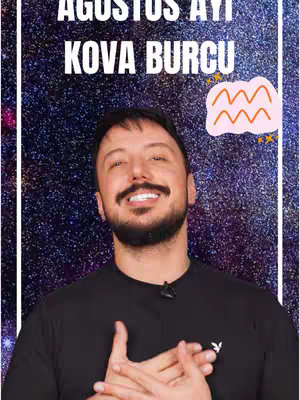 The cover image features a man centered against a starry, galaxy-like background. Large white text at the top reads "AĞUSTOS AYI" above "KOVA BURCU". To the right of the text, there is a stylized pink shape with the Aquarius symbol and some small yellow stars. The man is smiling and wearing a dark t-shirt with a small logo. The overall composition is bright and informative, hinting at an astrology-related video.