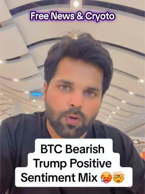 A man with dark hair and a beard is facing the camera. Above him is text that reads "Free News & Cryoto," and below him, a text box states "BTC Bearish Trump Positive Sentiment Mix" with relevant emojis. The background appears to be a bright indoor setting.