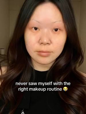 The cover photo features a young woman in a close-up shot. She has light skin, dark brown wavy hair, and is wearing a dark-colored top. Her eyebrows are thin. The background appears to be a simple, light-colored wall. The image has a neutral color palette, focusing on the woman's face and expression.