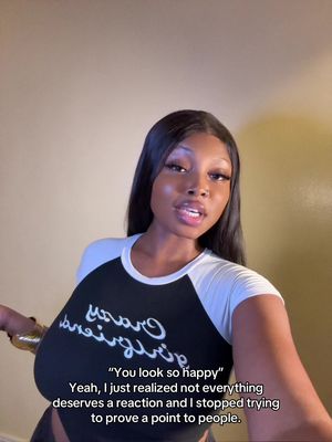 The cover image shows a young Black woman in a close-up shot, looking directly at the camera. She has long, straight black hair and is wearing a black and white baseball-style shirt. Text overlays the image in white font, with speech bubbles and a quote.