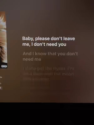 The cover image shows a screenshot of a music streaming app. Lyrics of a song are displayed in a large font overlayed on a dark backdrop that might be the actual user interface. The lyrics read: "Baby, please don't leave me, I don't need you" with additional verses below. The left side features a portion of the album art, suggesting the song's source.