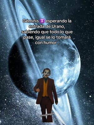 The cover image features the Joker in a burgundy suit and orange vest, centered against a background of a planet with rings, reminiscent of Saturn, and a star-filled sky. Text is overlaid, discussing Gemini and Uranus, using astrological symbols. The Joker appears to be walking towards the viewer, with a humorous expression, which is a lighthearted take on the astrological event.