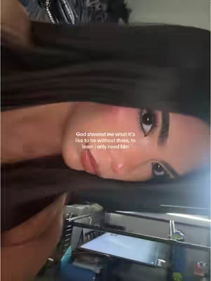 The cover image shows a close-up view of a person's face, with long, dark hair framing the face. The person appears to be looking towards the right side of the image, with a soft, natural lighting. Text is overlaid on the image, providing a quote.